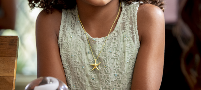 girl with star necklace remembrance jewelry