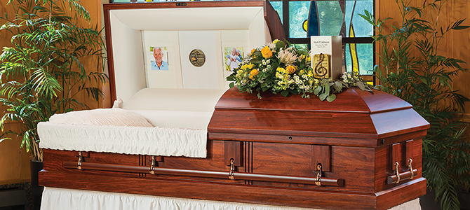 wood display casket topped with personalization items