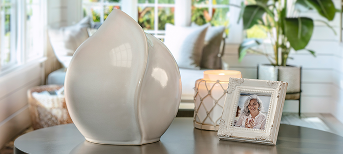 off white decorate rookwood urn on table